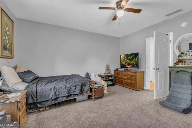 a bed room with a bed and a window