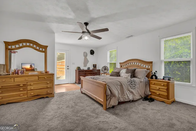 a dining room with furniture and wooden floor