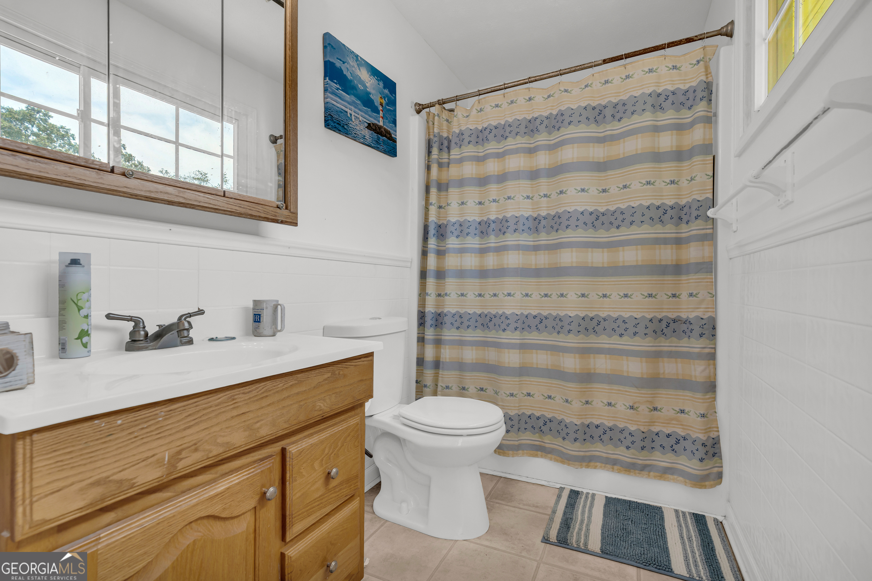 878 Jackson Street Locust Grove, GA 30248 - Photo 42 of 65 a bathroom with a sink toilet and shower