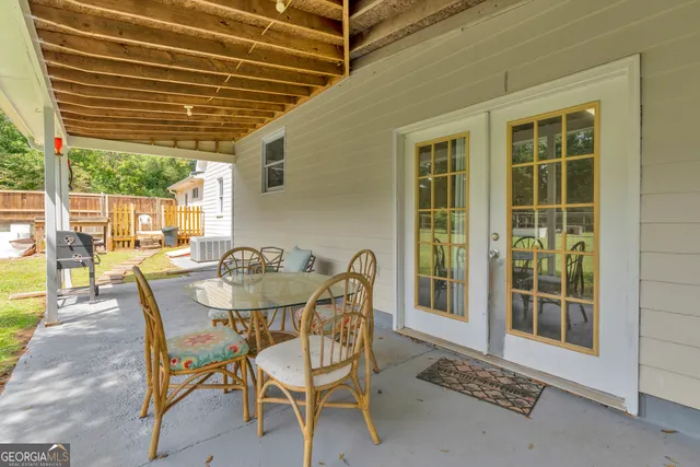 a view of a house with pool and a yard