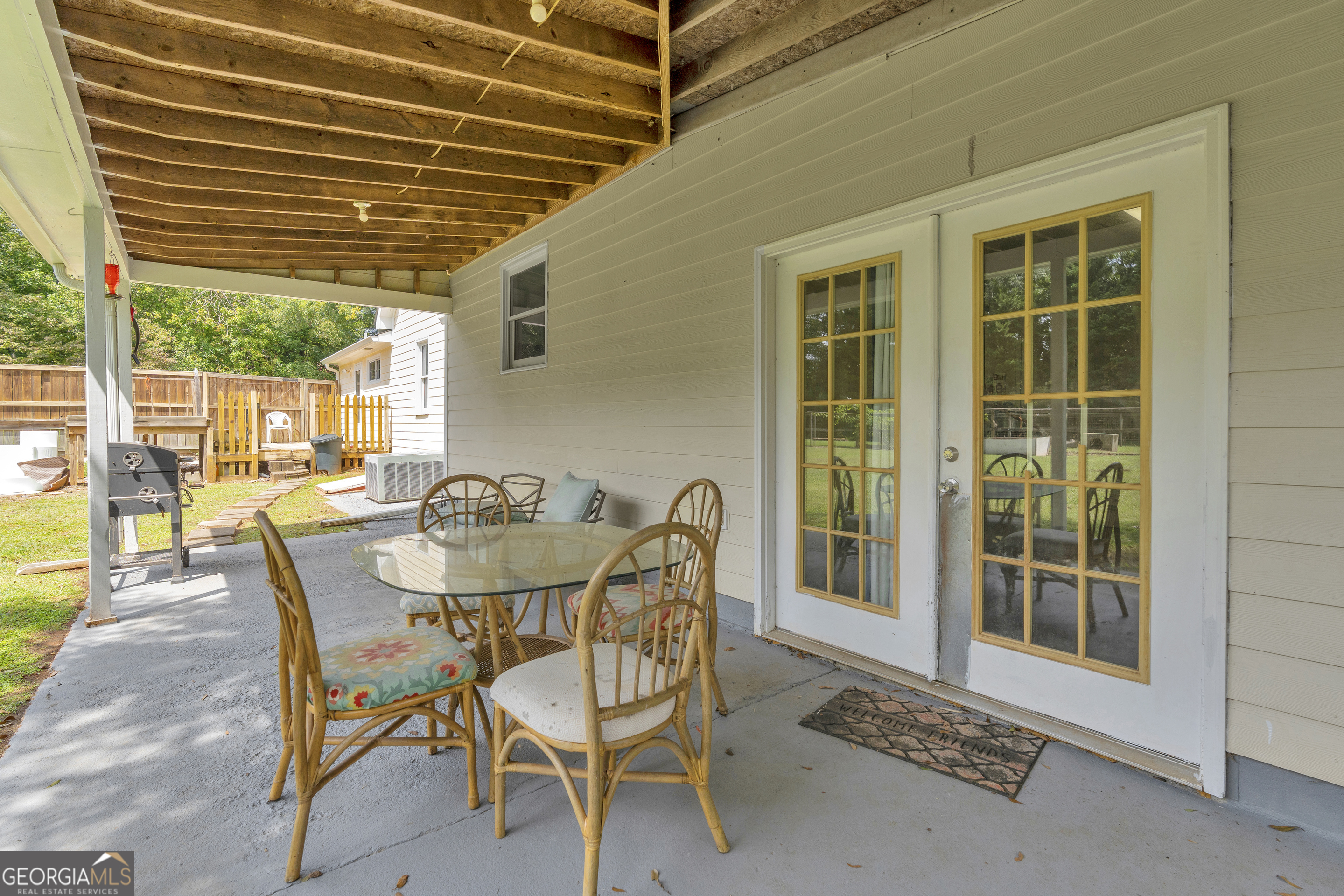 878 Jackson Street Locust Grove, GA 30248 - Photo 46 of 65 a dining room with furniture and wooden floor