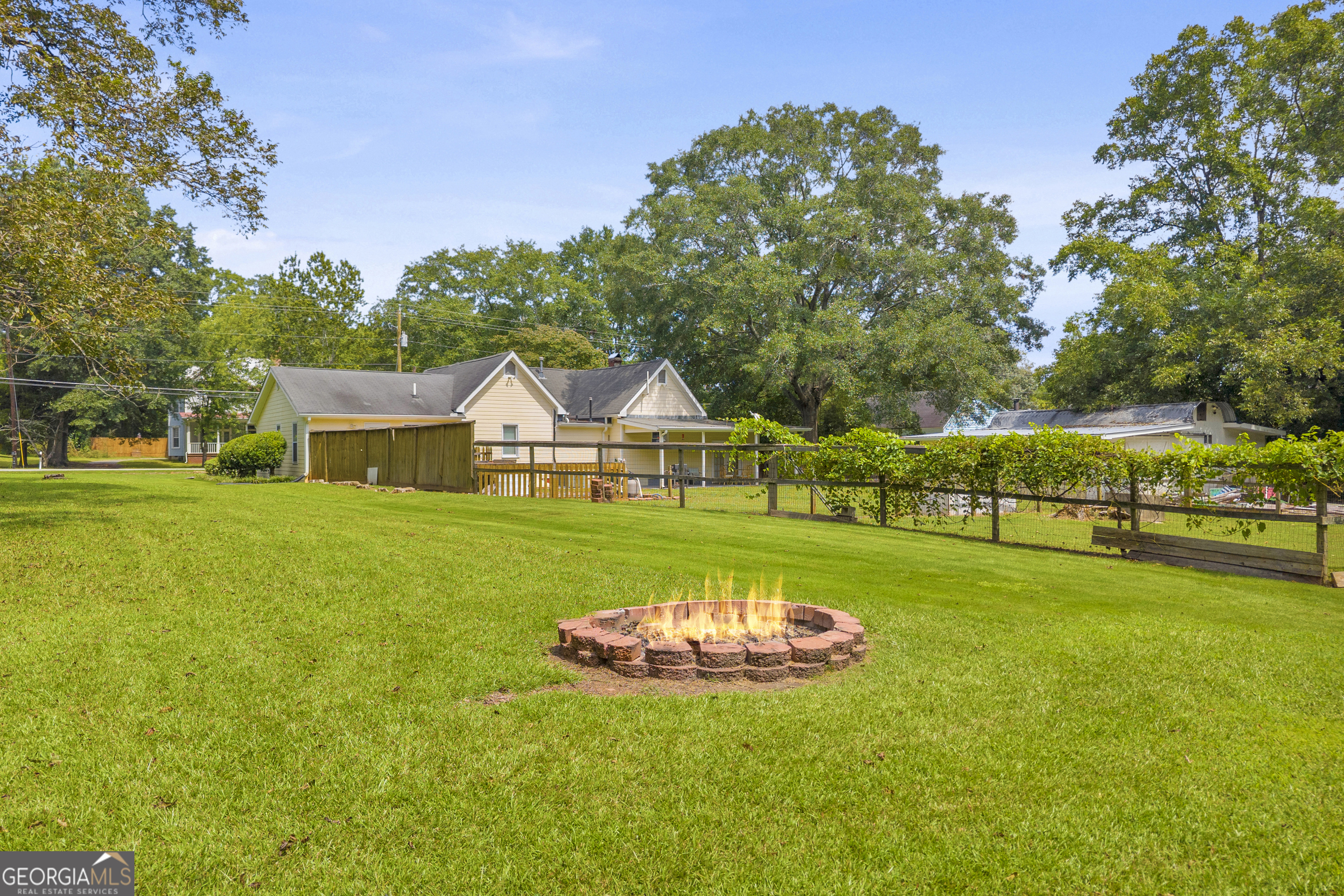 878 Jackson Street Locust Grove, GA 30248 - Photo 51 of 65 a view of a house with a big yard