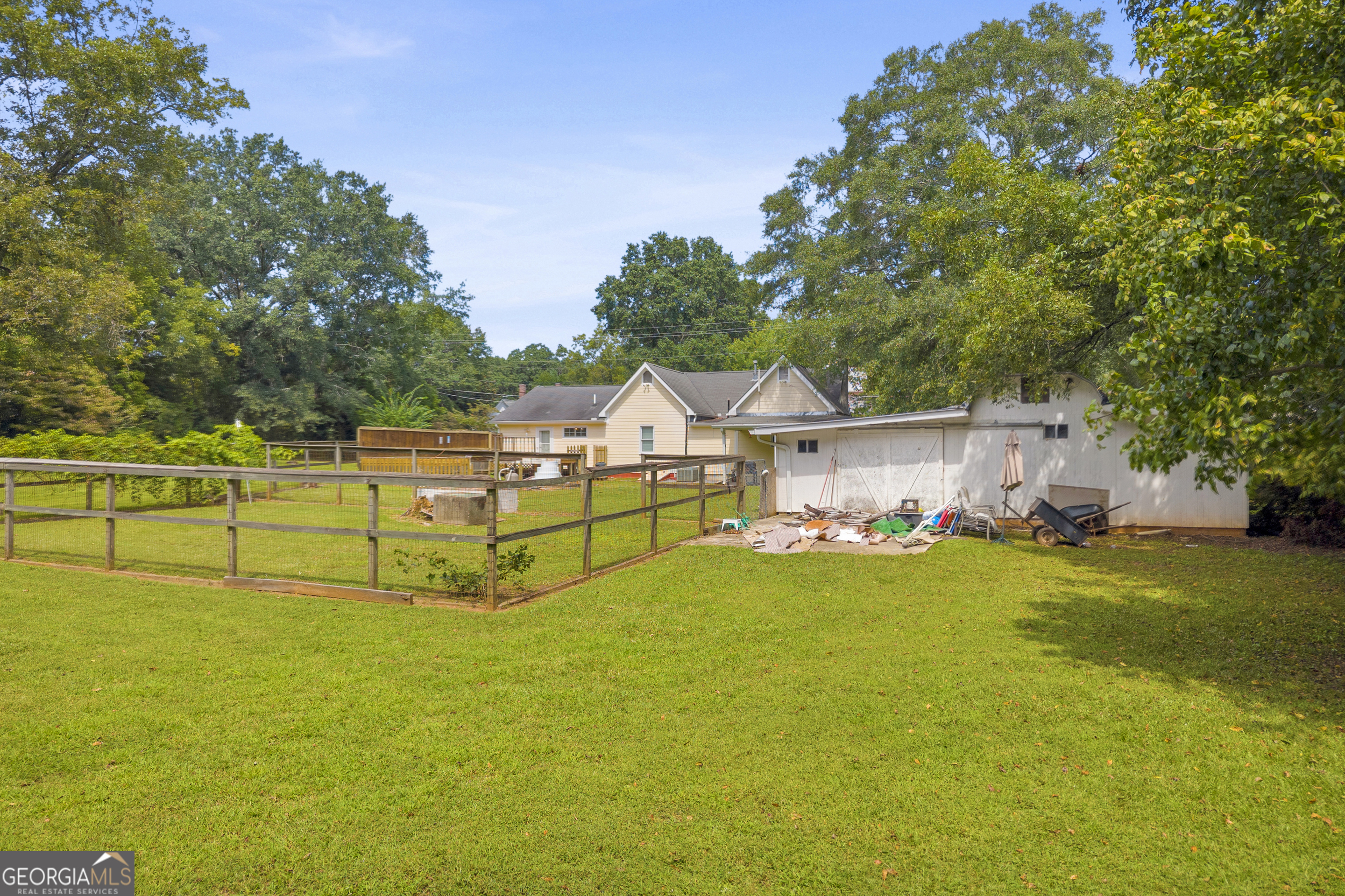878 Jackson Street Locust Grove, GA 30248 - Photo 53 of 65 a view of a house with pool and a yard