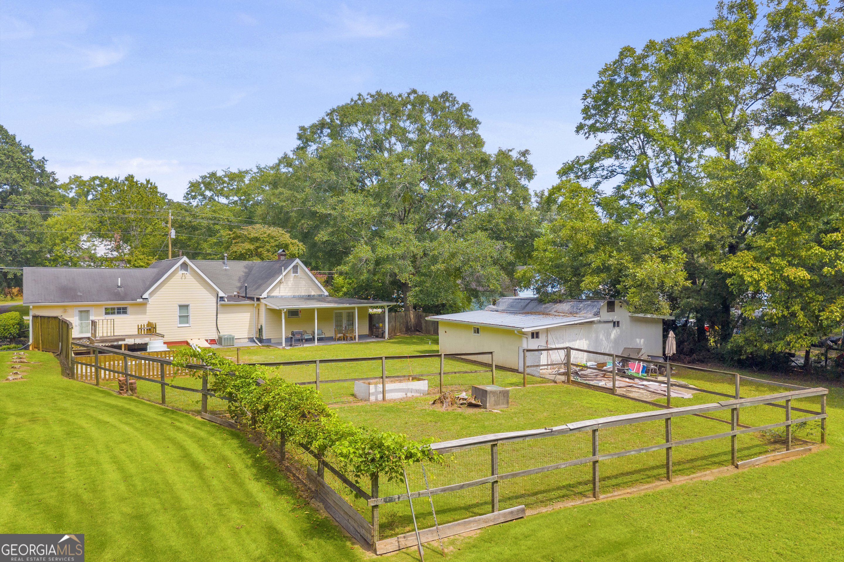 878 Jackson Street Locust Grove, GA 30248 - Photo 55 of 65 a view of a house with a swimming pool