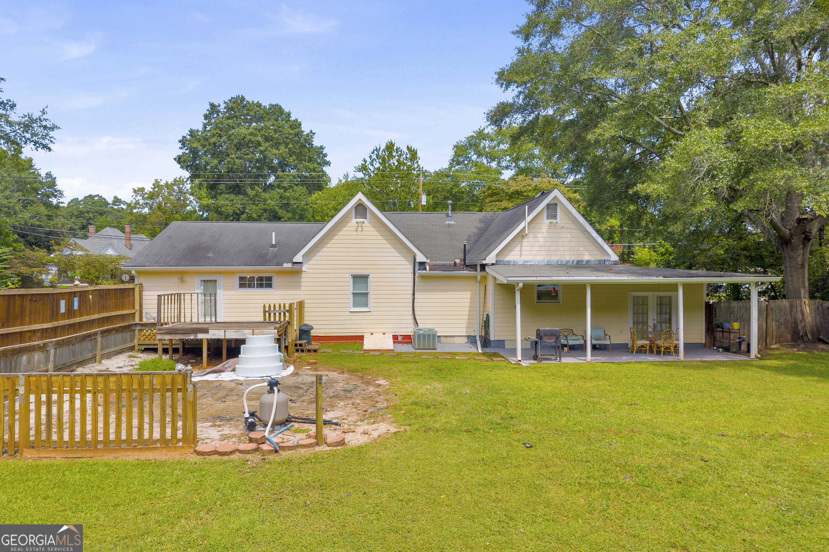 878 Jackson Street Locust Grove, GA 30248 - Photo 56 of 65 a view of a house with a yard deck and furniture