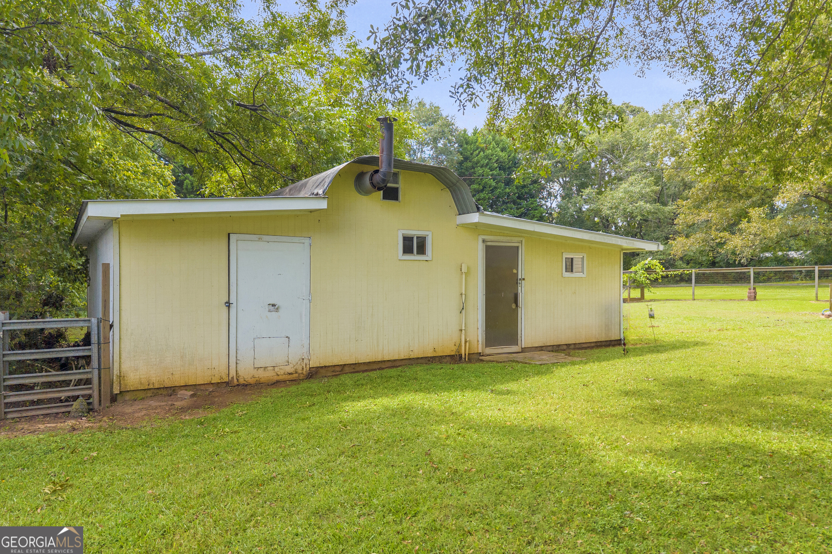 878 Jackson Street Locust Grove, GA 30248 - Photo 59 of 65 a view of a back yard of the house