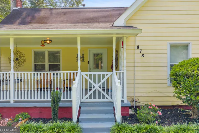 a view of a chair and table in the balcony