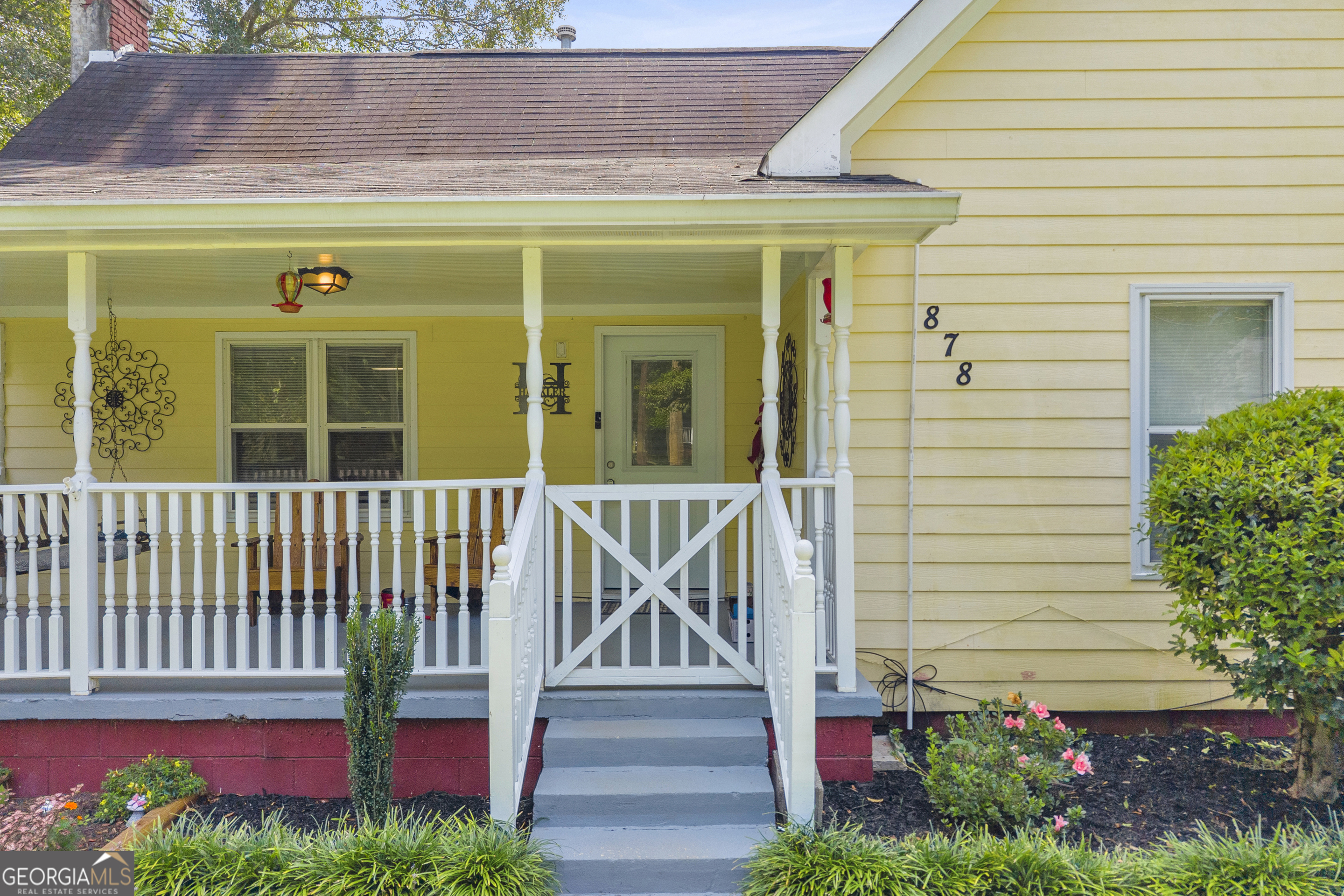 878 Jackson Street Locust Grove, GA 30248 - Photo 7 of 65 a view of a house with a small yard and wooden floor and fence