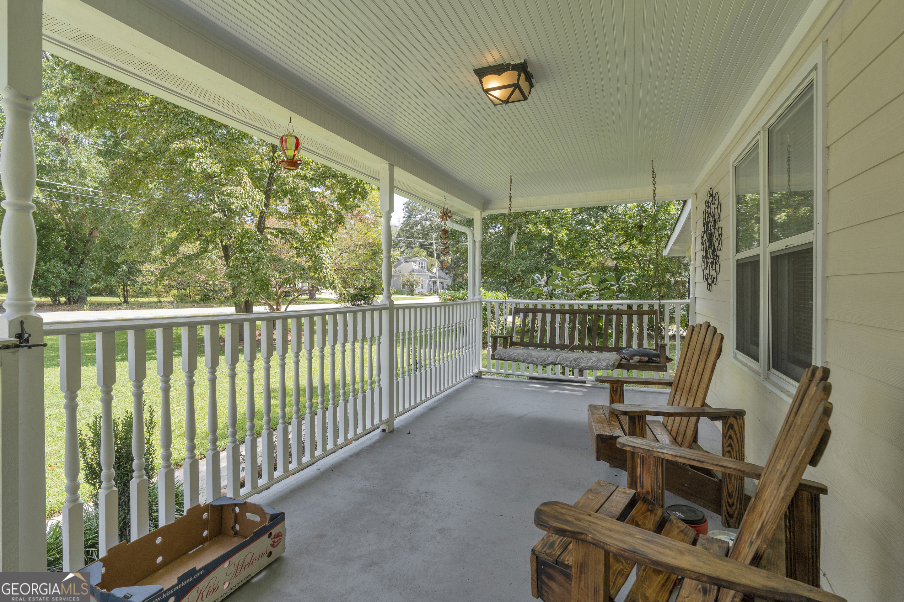 878 Jackson Street Locust Grove, GA 30248 - Photo 8 of 65 a view of a chair and table in the balcony