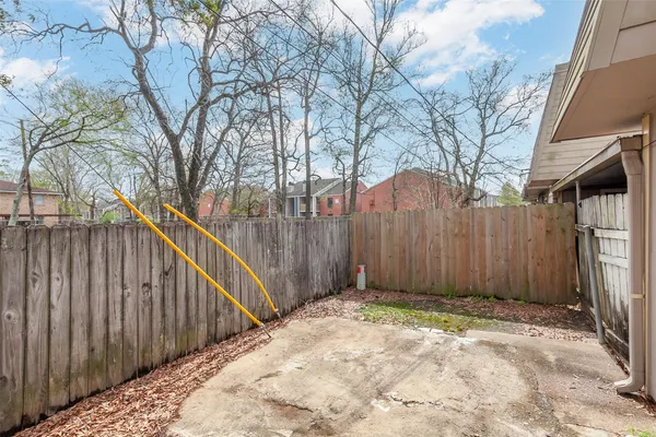 a view of a balcony with wooden fence and floor