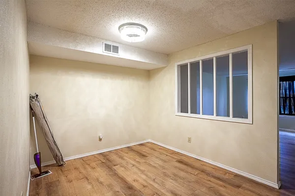 a kitchen with stainless steel appliances granite countertop a stove a microwave and a refrigerator