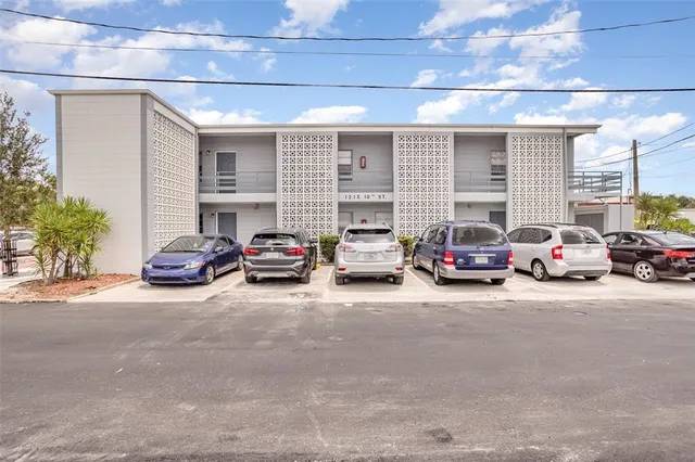 a view of a cars parked in front of a building