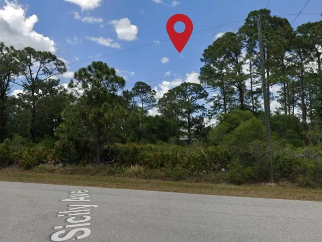 a view of a swimming pool with a yard