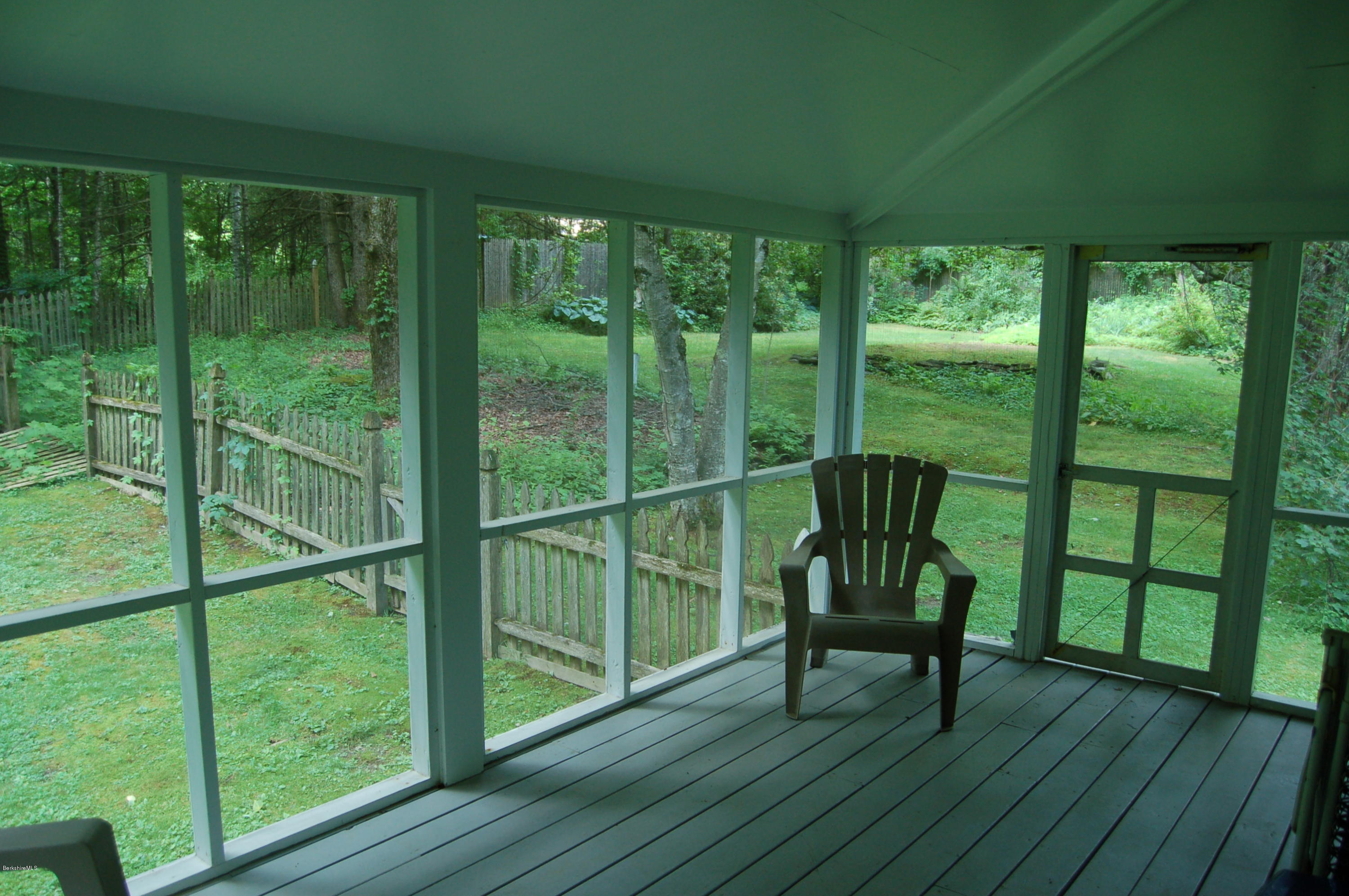 4 West Dale Road Stockbridge, MA 01229 - Photo 11 of 16 a view of a deck with chair and floor to ceiling window