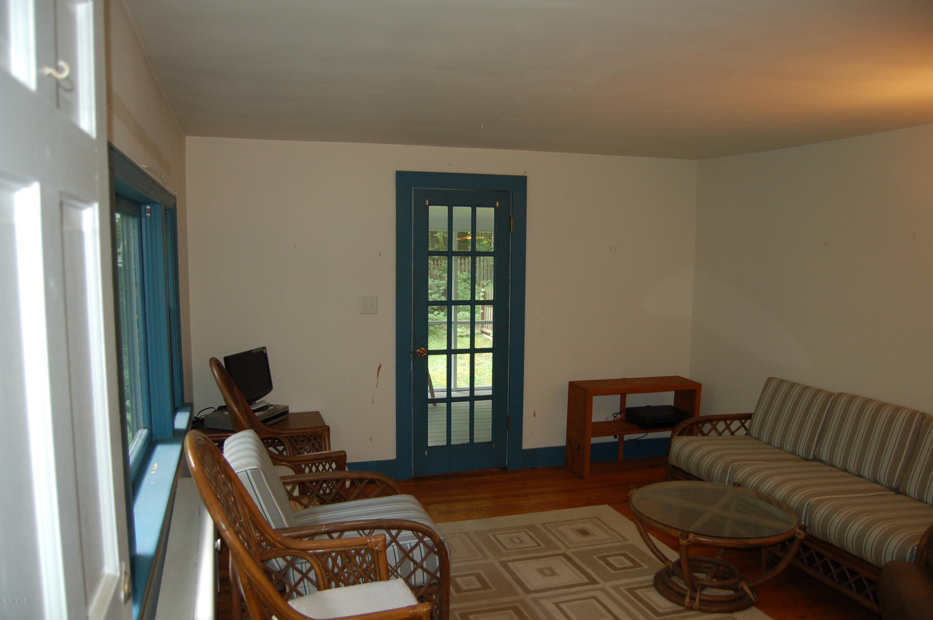 4 West Dale Road Stockbridge, MA 01229 - Photo 3 of 16 a living room with furniture a window and a flat screen tv