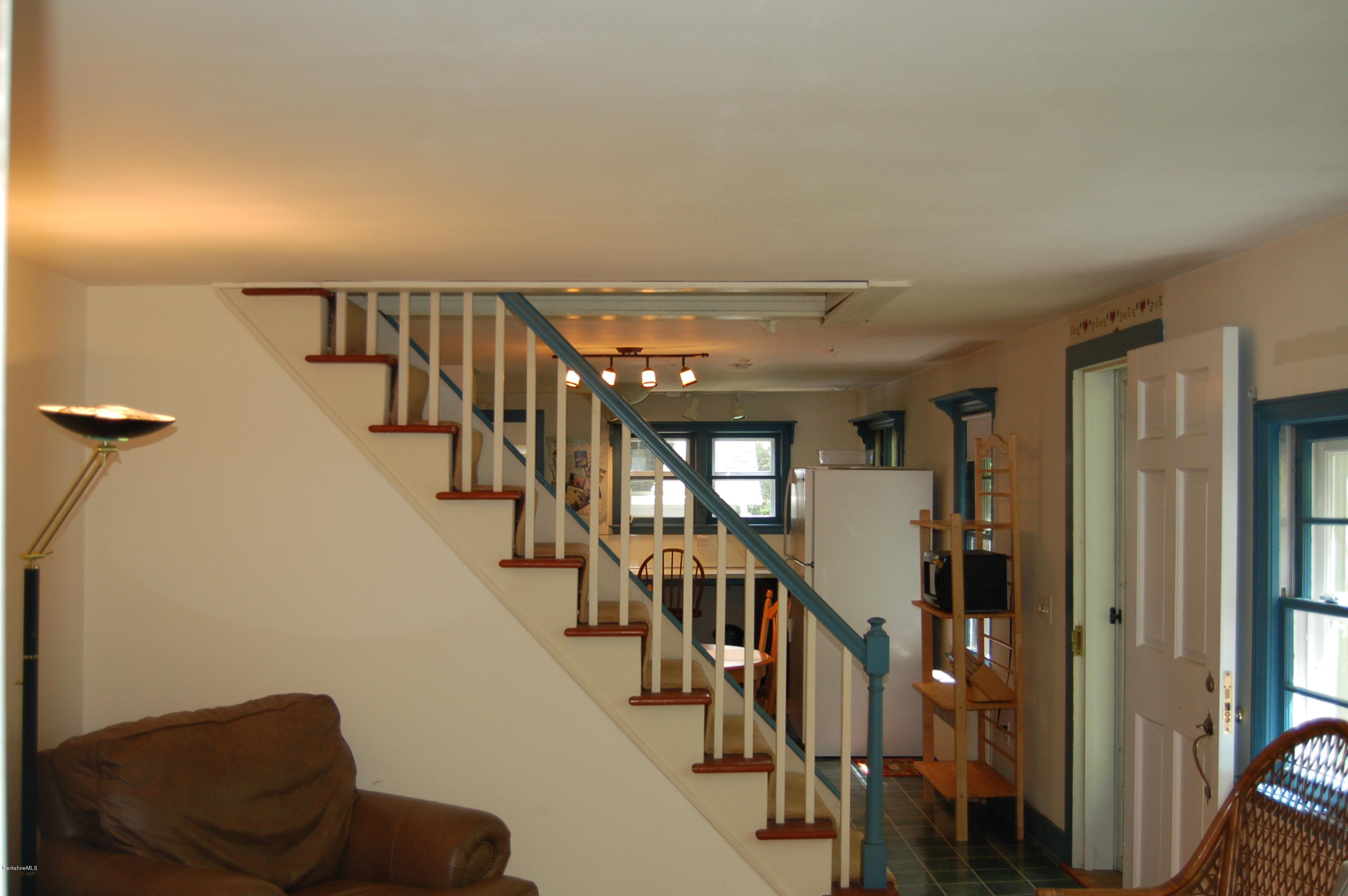 4 West Dale Road Stockbridge, MA 01229 - Photo 4 of 16 a hallway with wooden floor and stairs