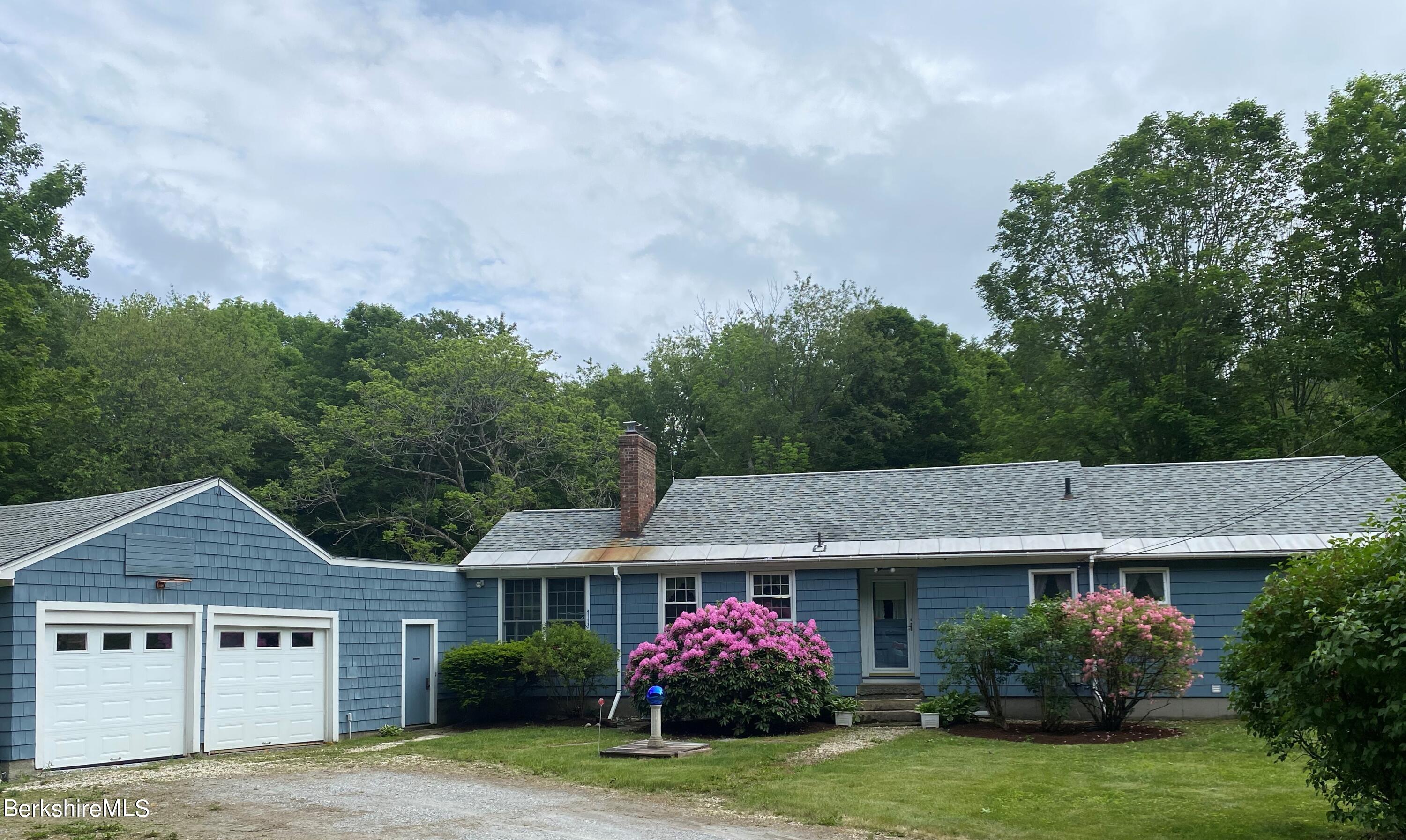 983 State Road Richmond, MA 01254 - Photo 1 of 47 a front view of a house with garden