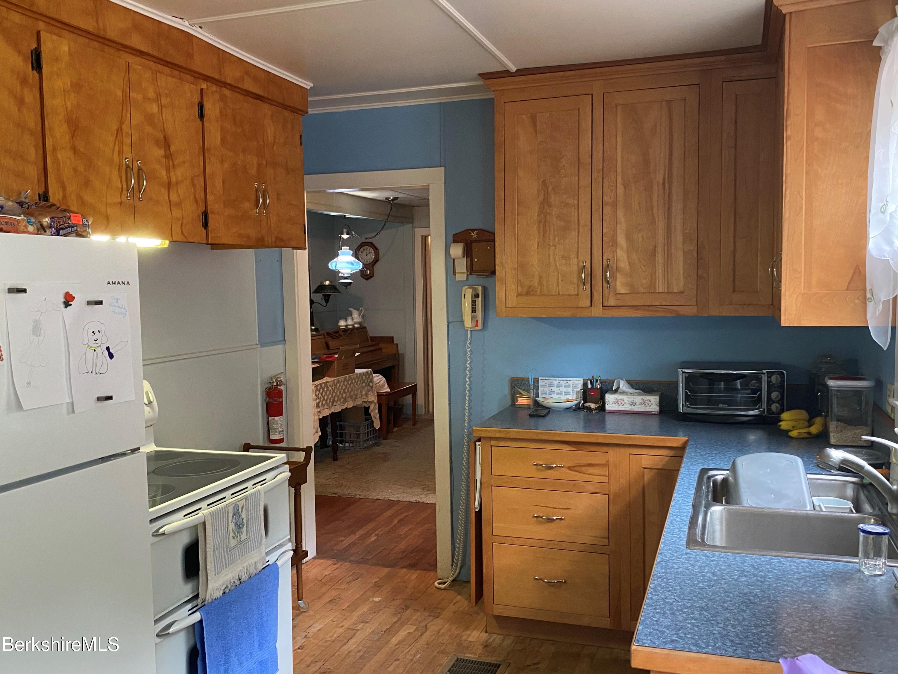 983 State Road Richmond, MA 01254 - Photo 20 of 47 a kitchen with a refrigerator and a stove