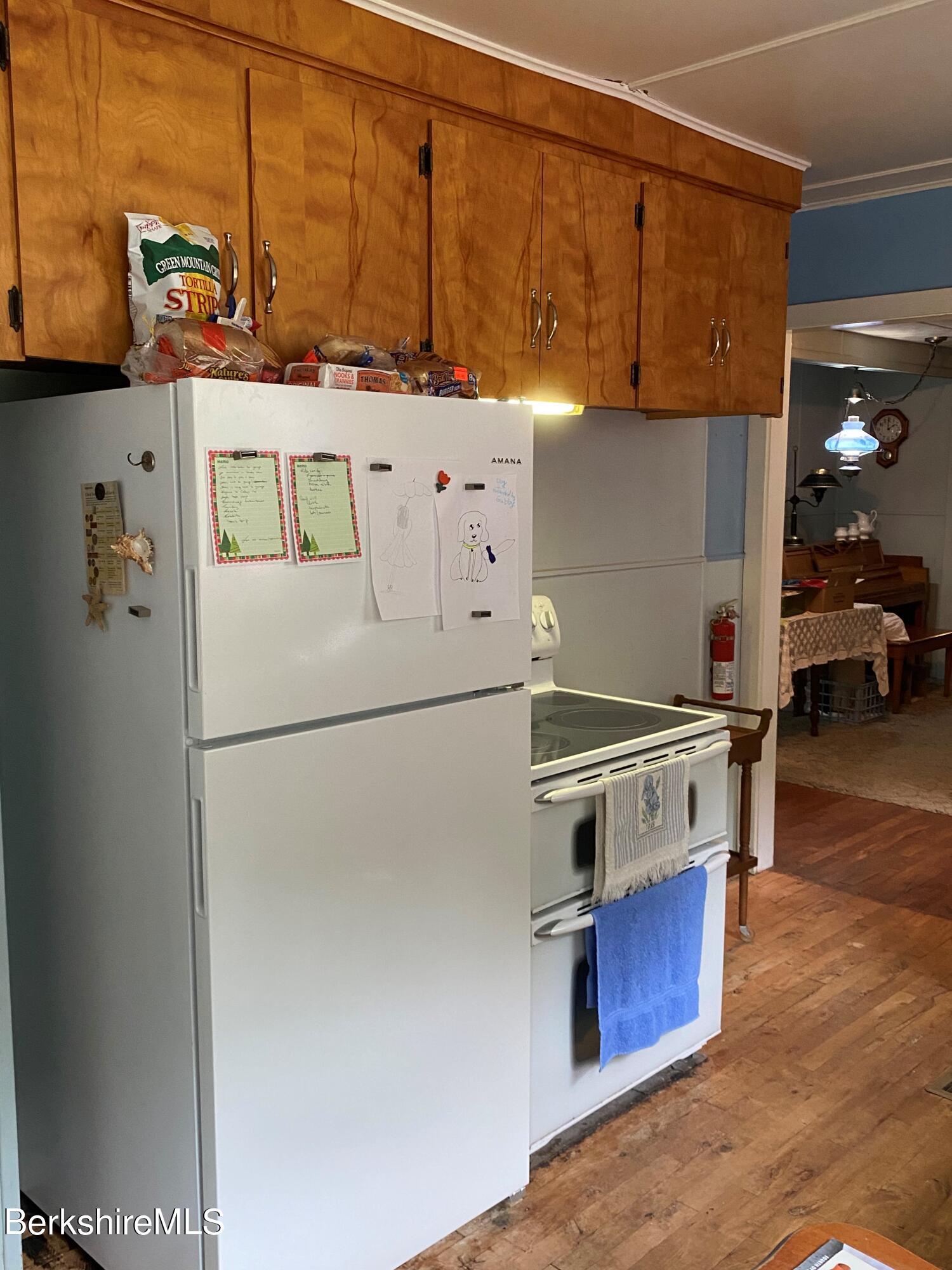983 State Road Richmond, MA 01254 - Photo 21 of 47 a kitchen with stainless steel appliances a stove a refrigerator and a cabinets