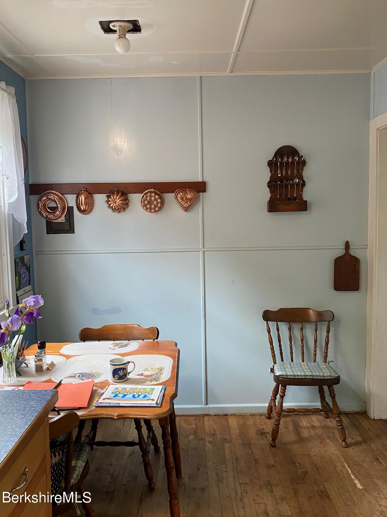 983 State Road Richmond, MA 01254 - Photo 24 of 47 a dining room with a table and chairs