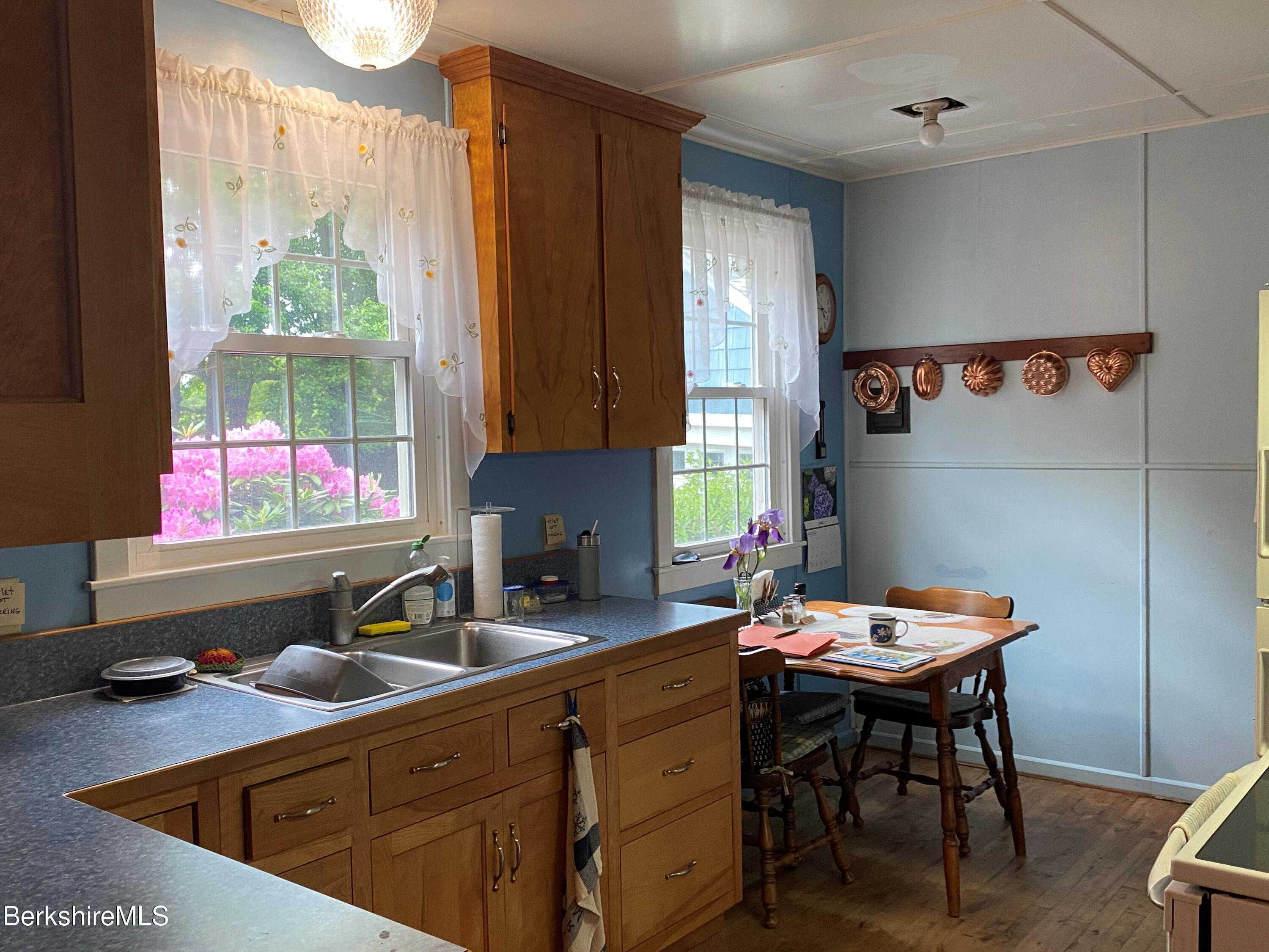 983 State Road Richmond, MA 01254 - Photo 25 of 47 a kitchen with a sink stove and cabinets