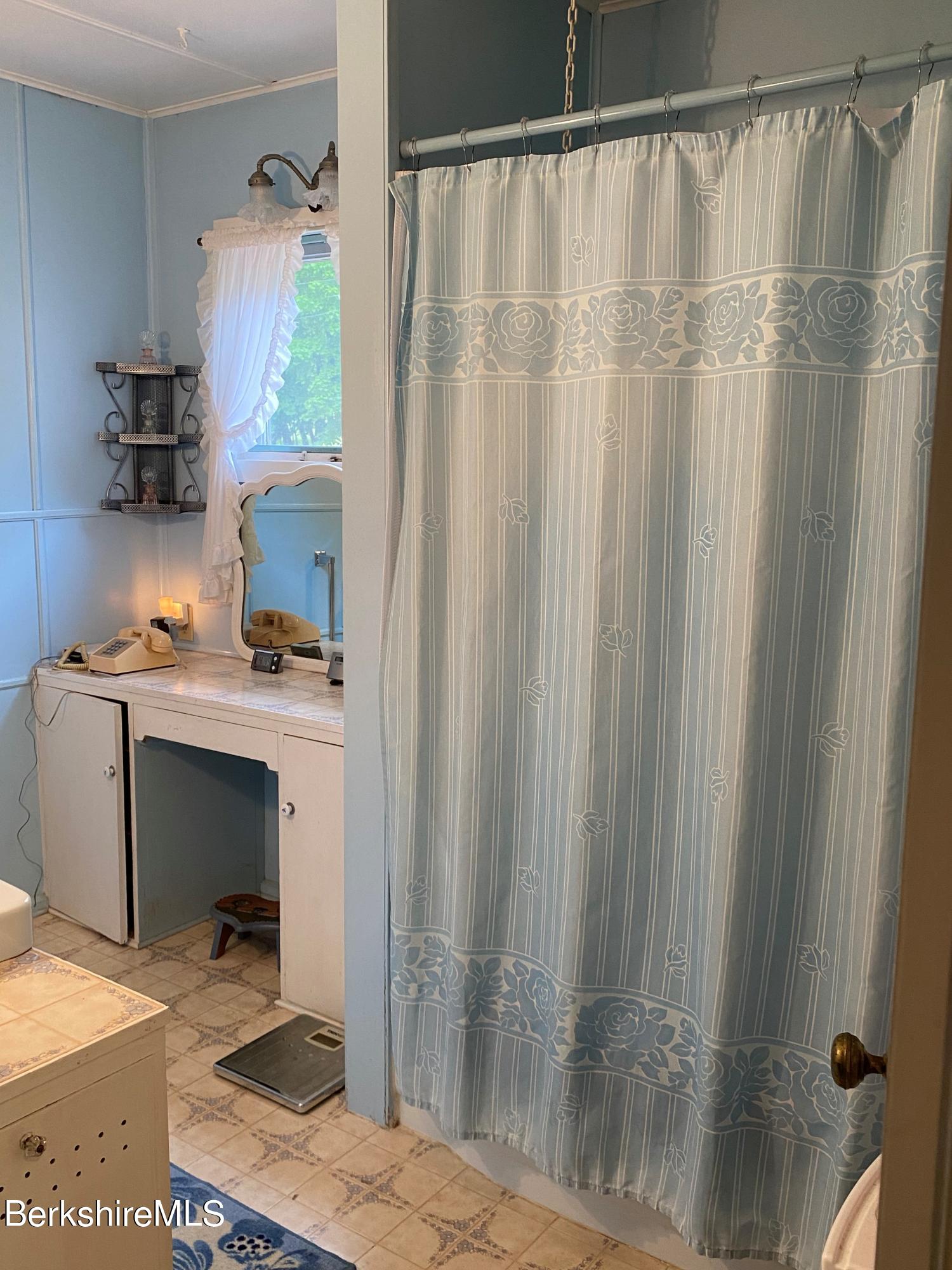 983 State Road Richmond, MA 01254 - Photo 27 of 47 a bedroom with a bed and a window