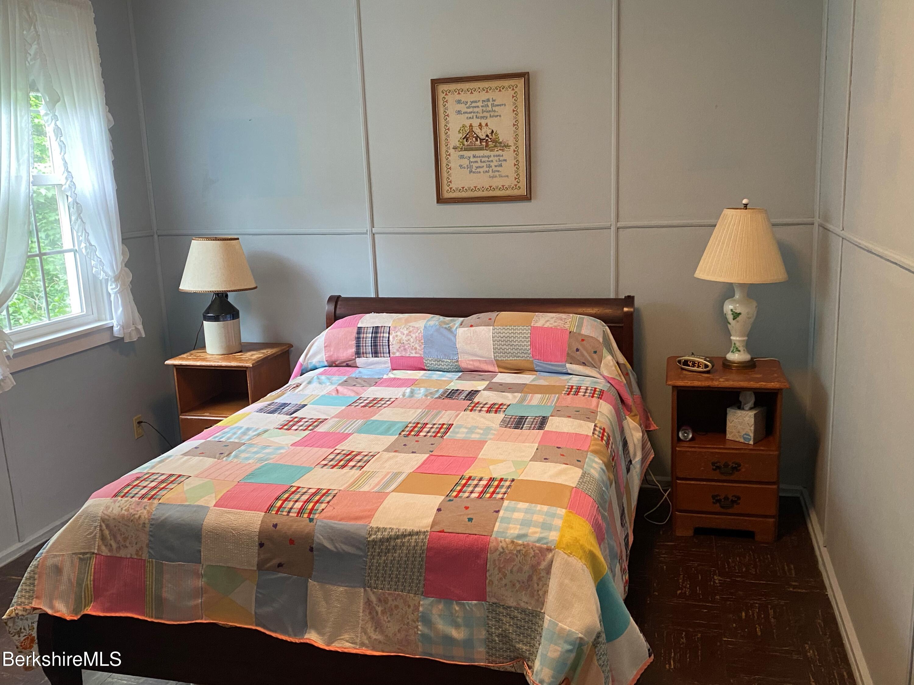 983 State Road Richmond, MA 01254 - Photo 29 of 47 a bedroom with a bed and a lamp
