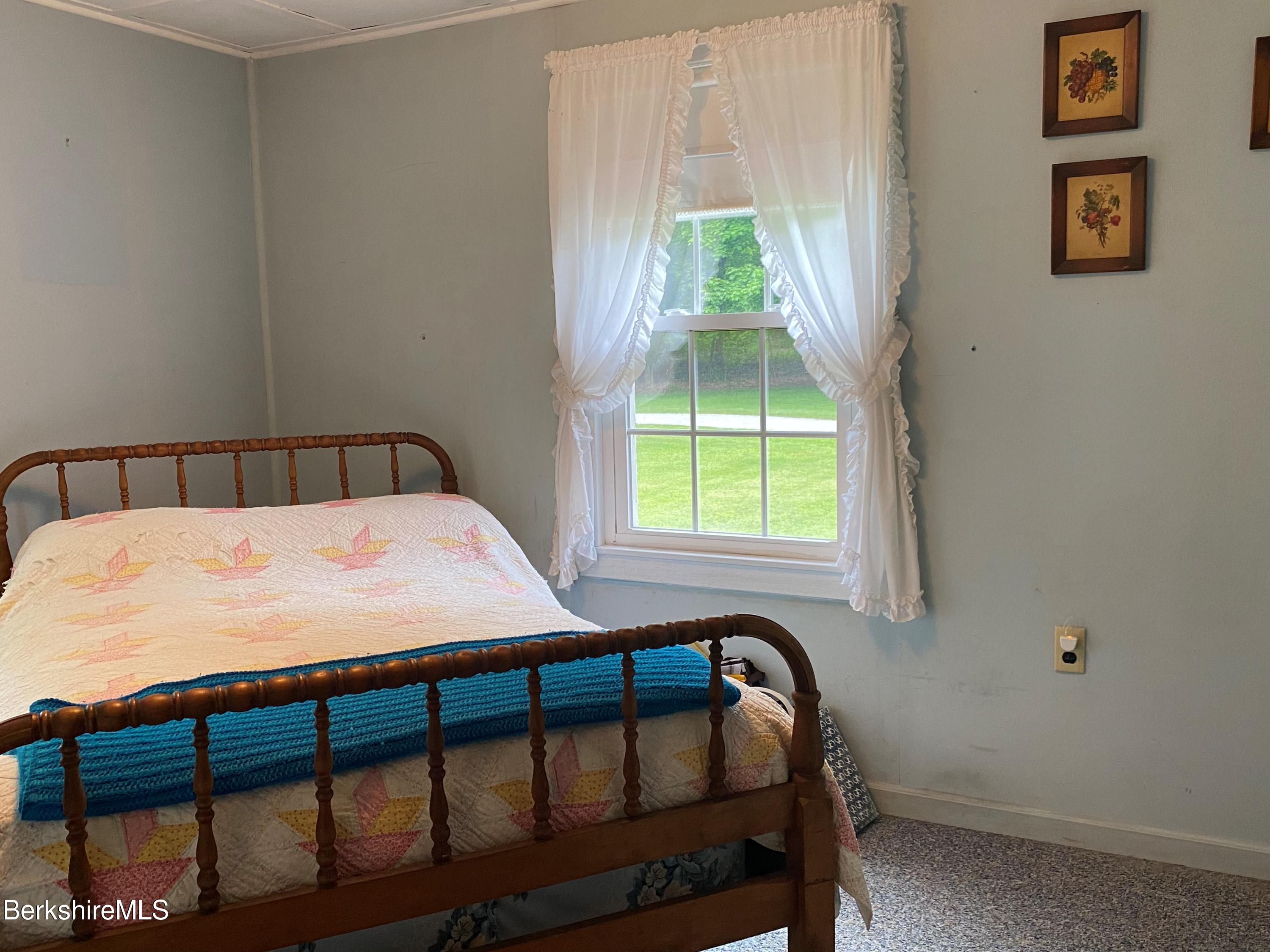 983 State Road Richmond, MA 01254 - Photo 31 of 47 a bedroom with a bed and a window