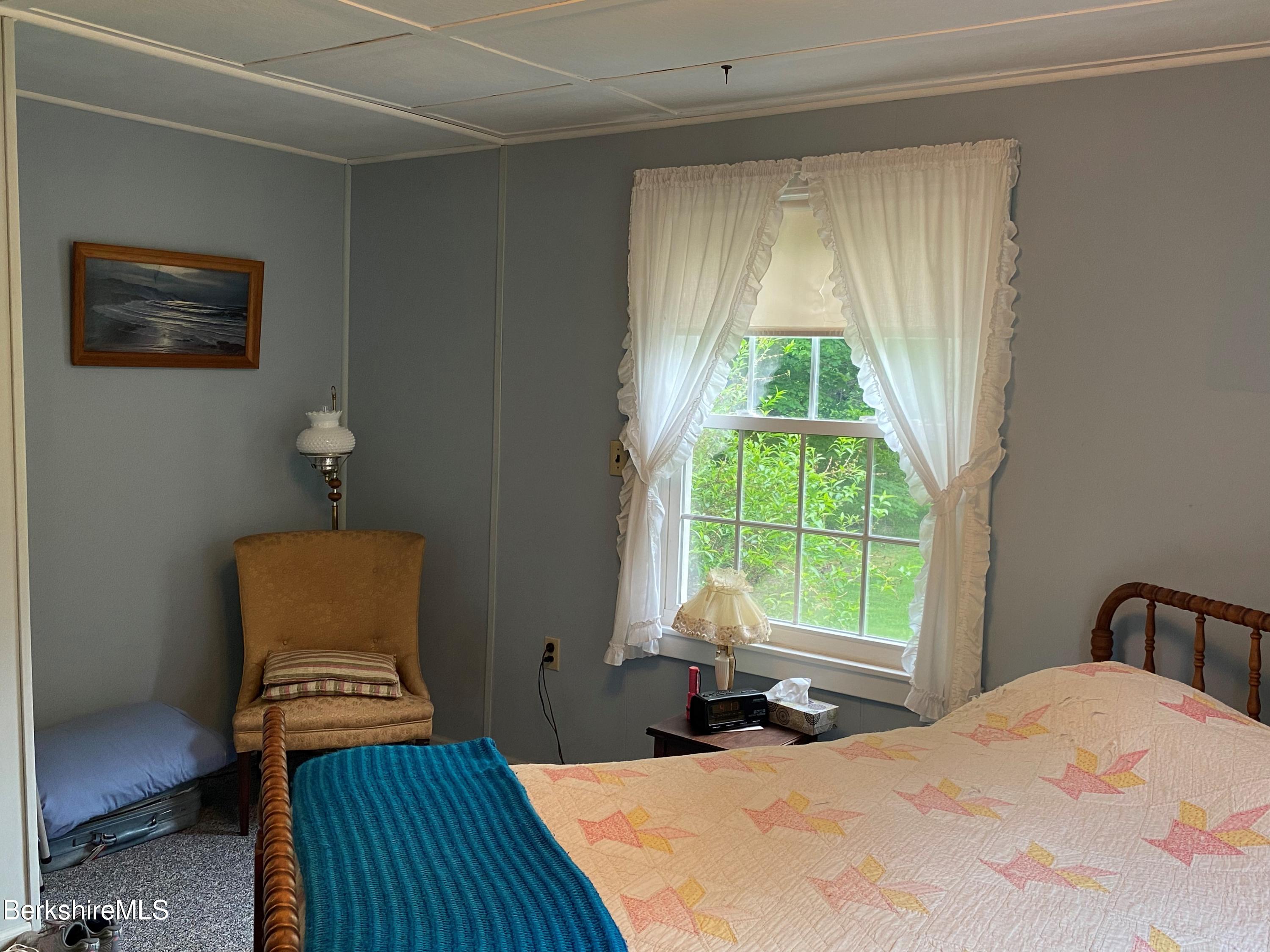983 State Road Richmond, MA 01254 - Photo 32 of 47 a bedroom with a bed and a window