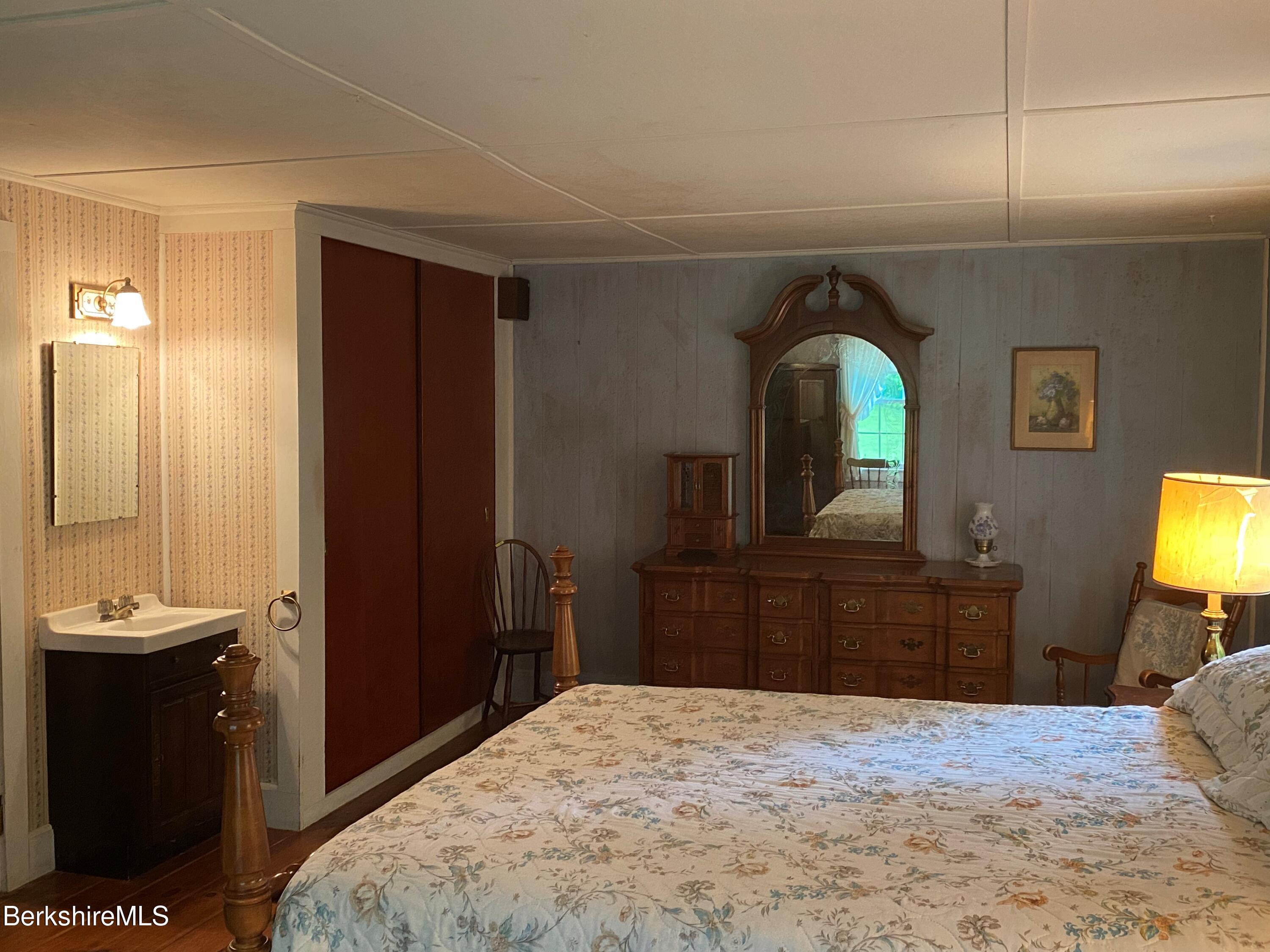 983 State Road Richmond, MA 01254 - Photo 35 of 47 a bedroom with a bed and a dresser in it