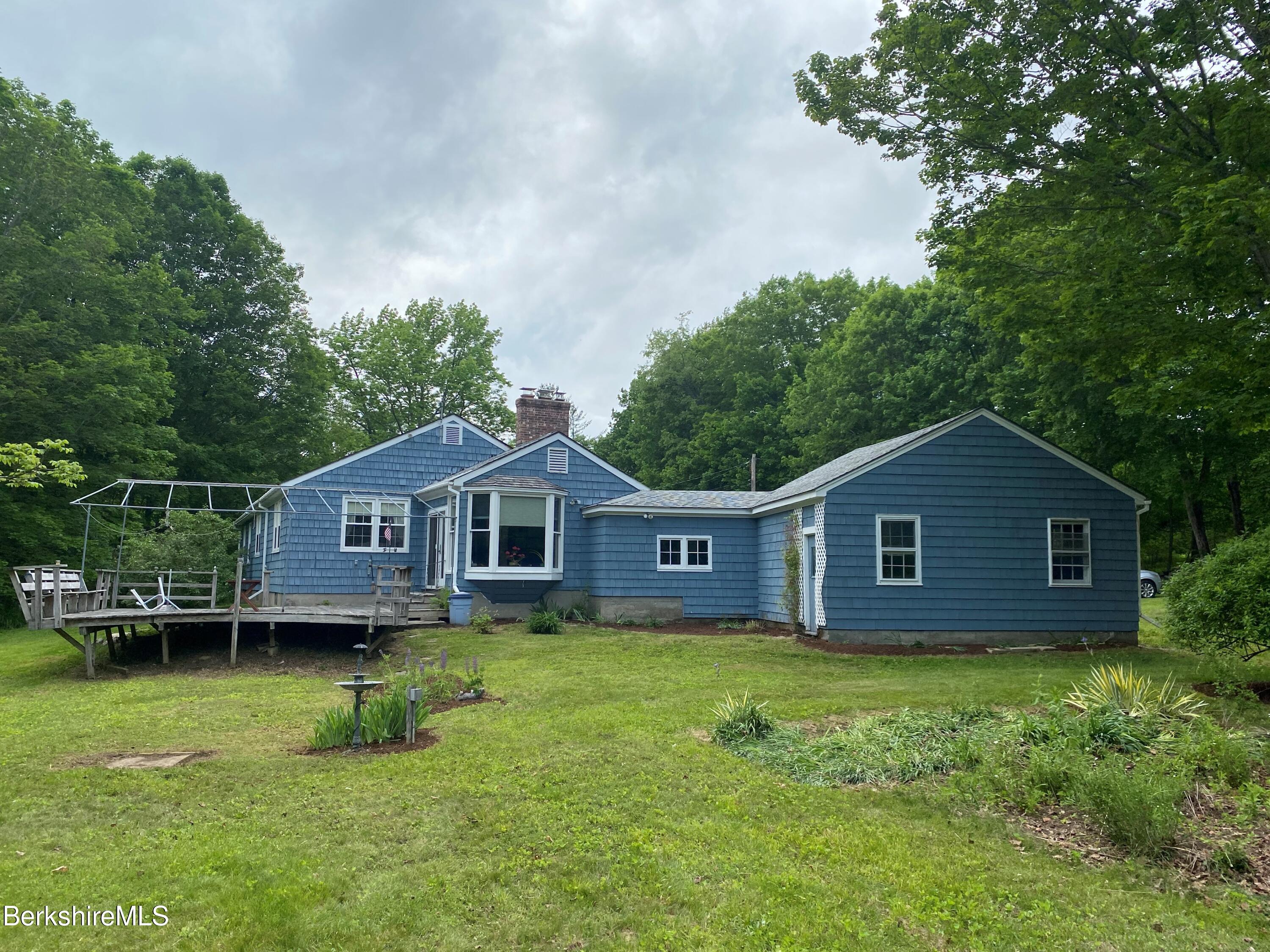 983 State Road Richmond, MA 01254 - Photo 8 of 47 a view of a house with a big yard potted plants and large tree