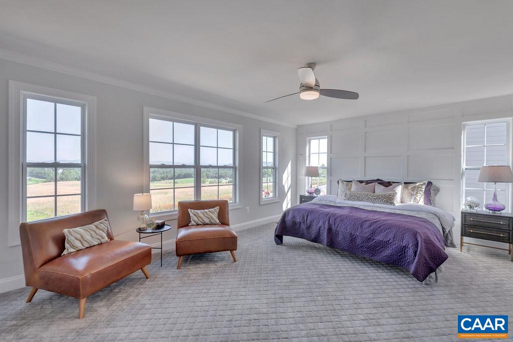 25 Wexford Ridge Road Ruckersville, VA 22968 - Photo 25 of 41 a spacious bedroom with a bed couch and windows