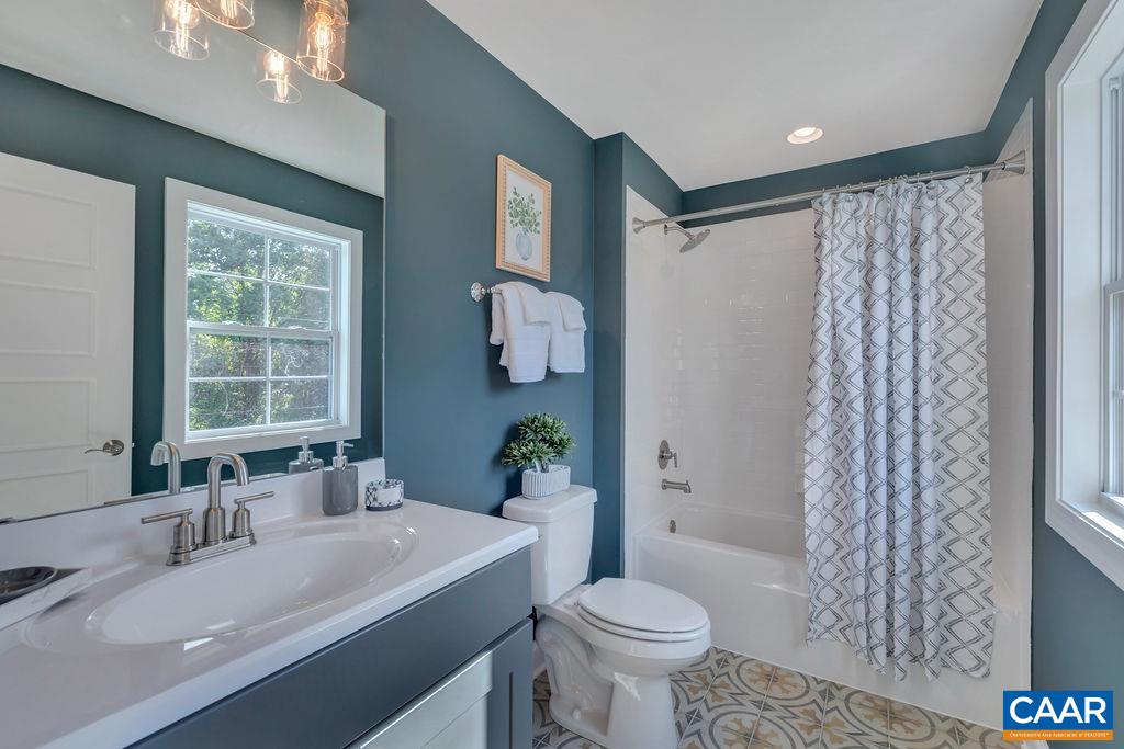 25 Wexford Ridge Road Ruckersville, VA 22968 - Photo 32 of 41 a bathroom with a sink toilet and shower