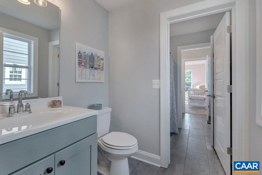 25 Wexford Ridge Road Ruckersville, VA 22968 - Photo 34 of 41 a bathroom with a toilet sink and mirror