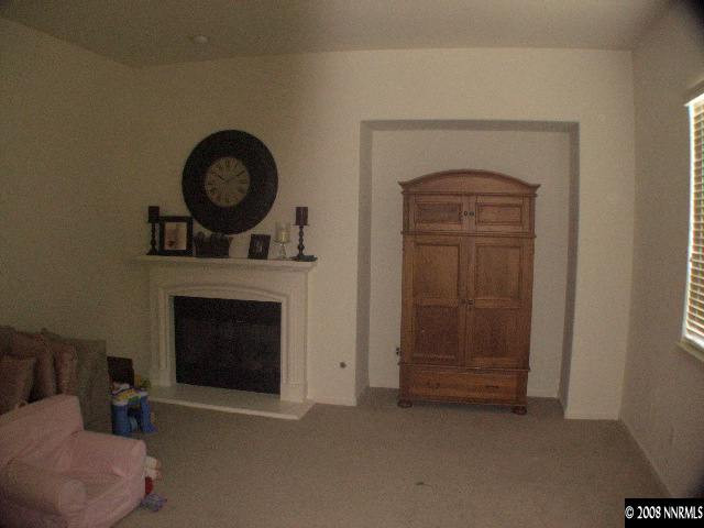 10654 Autumn Walk Lane Reno, NV 89521 - Photo 5 of 7 a living room with furniture and a fireplace