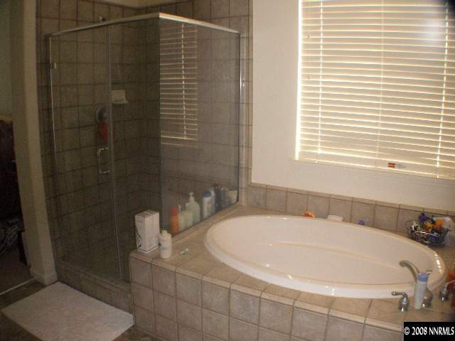 10654 Autumn Walk Lane Reno, NV 89521 - Photo 6 of 7 a white bath tub sitting next to a white toilet