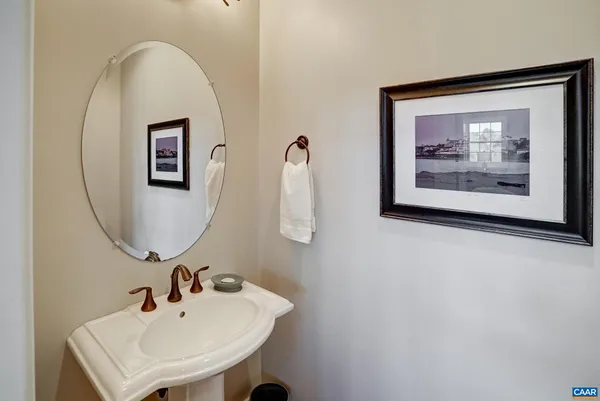 a spacious bedroom with a bed a dresser and a window