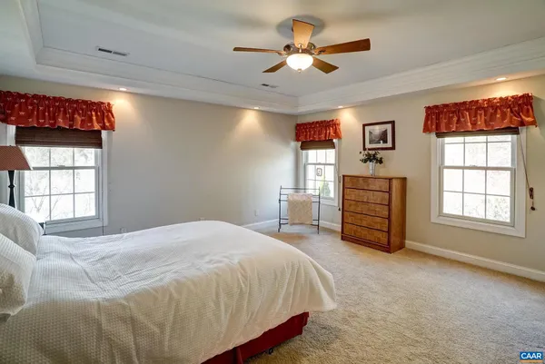 a living room with furniture a chandelier and pool table