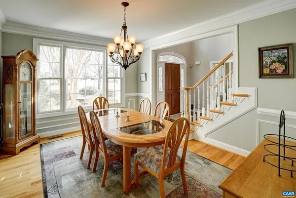 a living room with furniture fireplace and a large window