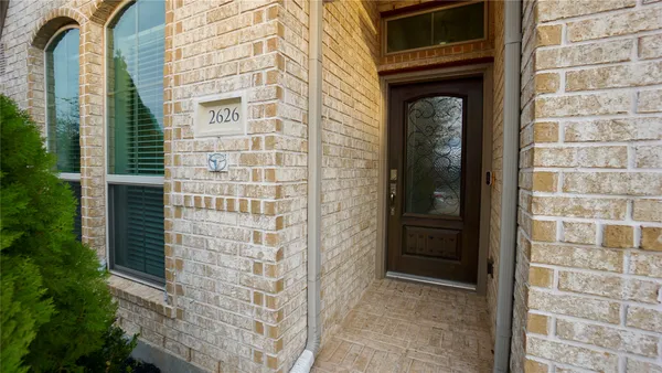 a front view of a house with a glass door