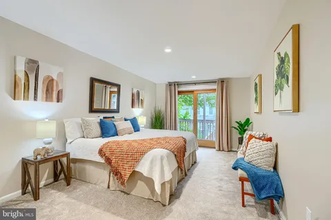 a bedroom with a bed and a couch