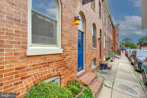 a view of a brick building with many windows
