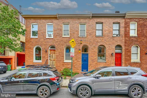 a front view of a house with parking space