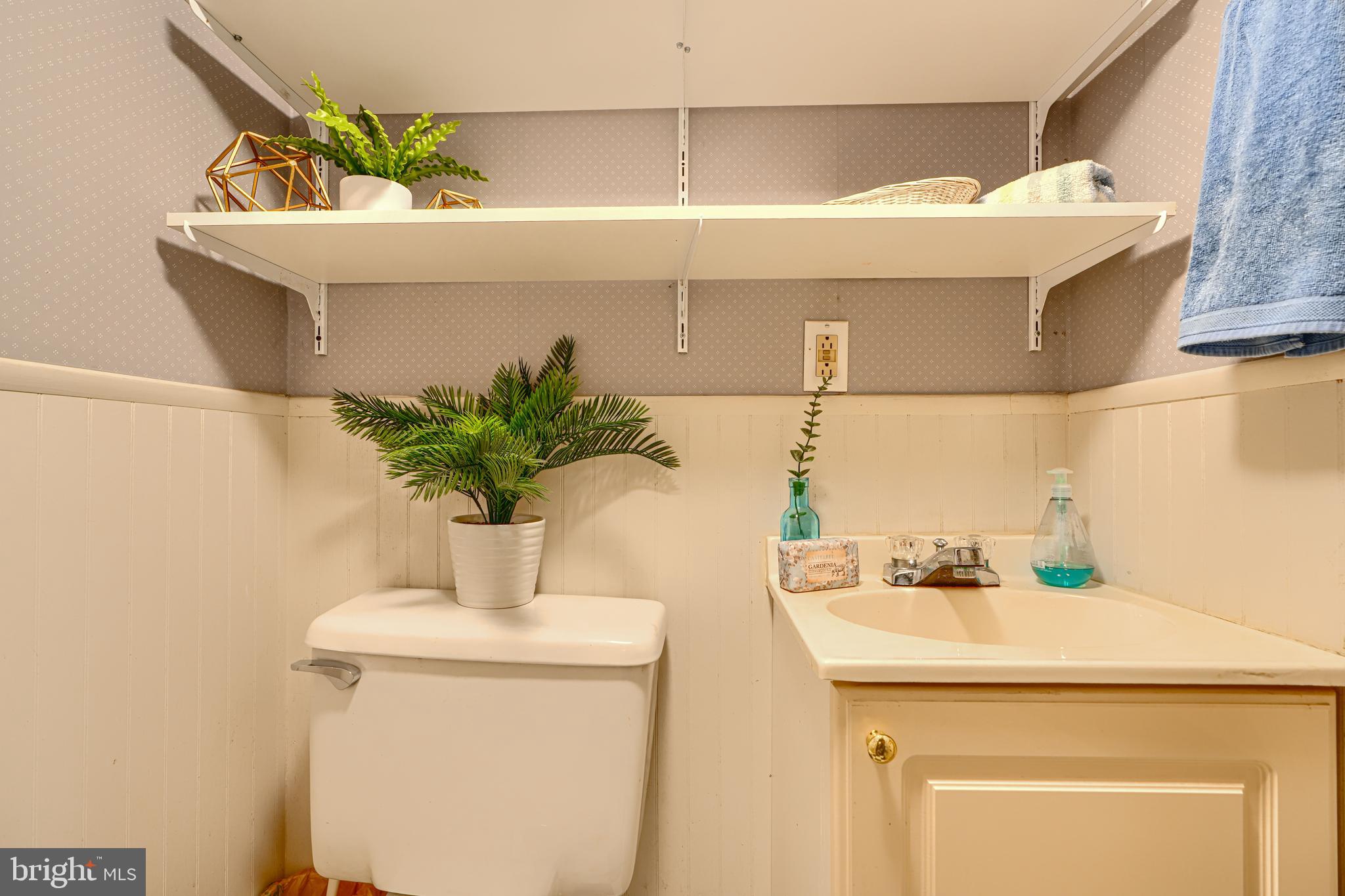 417 Grindall Street Baltimore, MD 21230 - Photo 36 of 37 a bathroom with a sink and a mirror