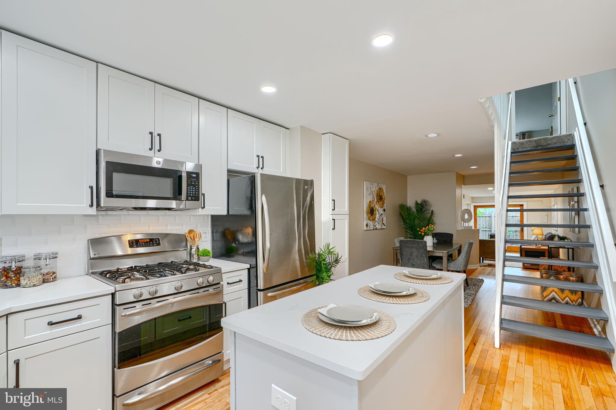 417 Grindall Street Baltimore, MD 21230 - Photo 4 of 37 a kitchen with stainless steel appliances a stove a sink and a refrigerator