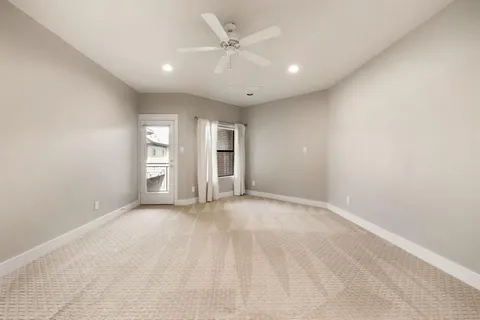 a spacious bathroom with a granite countertop sink mirror and a bathtub
