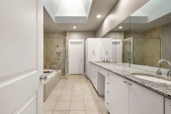 a bathroom with a bathtub and shower