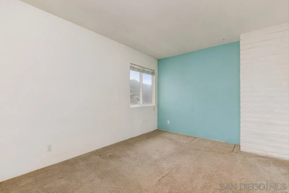 11949 Rocoso Road Lakeside, CA 92040 - Photo 12 of 27 a view of an empty room with a window