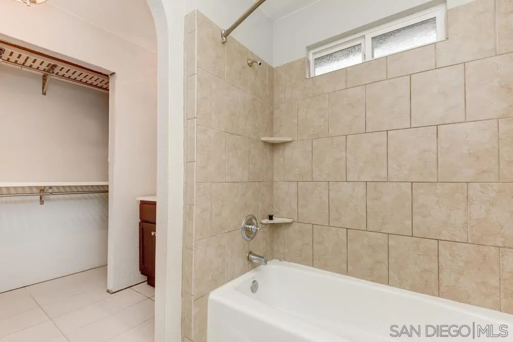 11949 Rocoso Road Lakeside, CA 92040 - Photo 18 of 27 a white bath tub sitting next to a shower