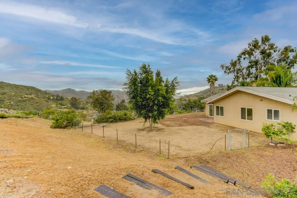 11949 Rocoso Road Lakeside, CA 92040 - Photo 25 of 27 a view of a house with a yard